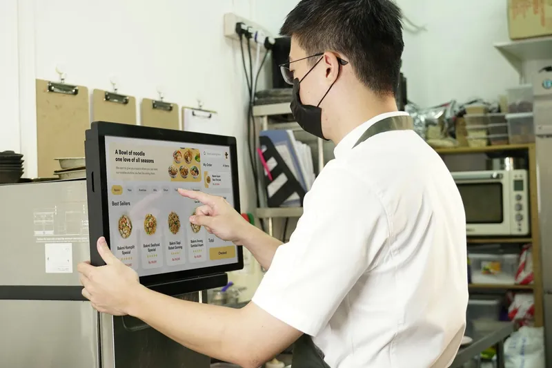 Staff checking receipt
